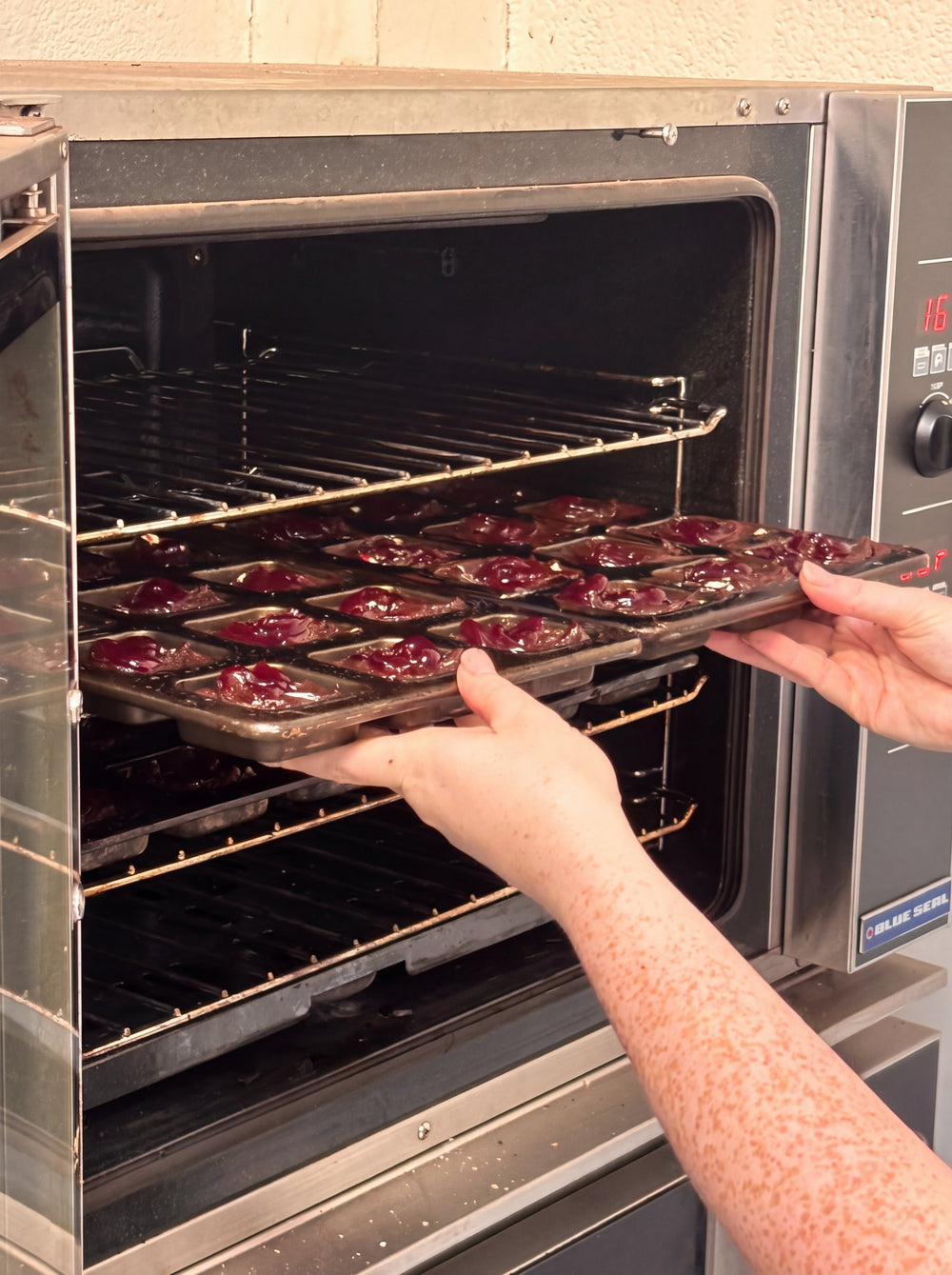 A tray of brownie batter going into the oven