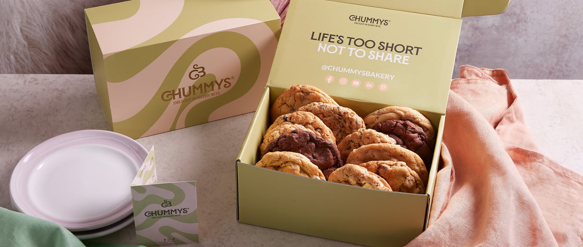 An open Chummys Bakery box of cookies with the message Life is too short not to share
